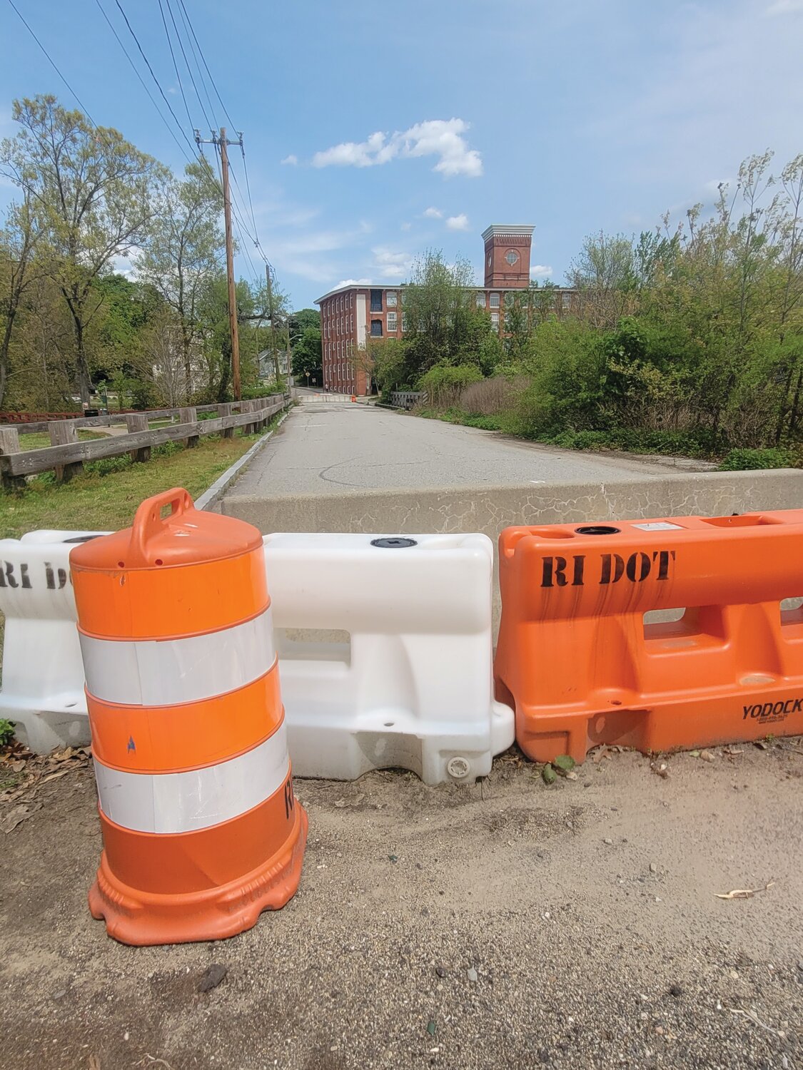 GO BACK THE WAY YOU CAME: Orange barricades, erected by RI DOT, block both sides of the Greystone Sluiceway Bridge on the border of Johnston and North Providence.
